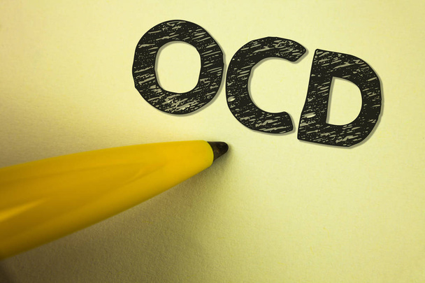 Word writing text Ocd. Business concept for Obsessive Compulsive Disorder Psychological Illness Medical Condition written on plain background Pen next to it. - 写真・画像