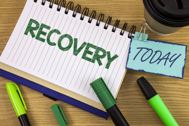 Writing note showing  Recovery. Business photo showcasing Return to normal state of health Regain possession or control written on Noteoad on wooden background Today Cup Pen Marker next to it - Photo, Image
