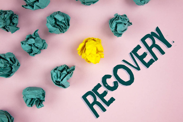 Word writing text Recovery. Business concept for Return to normal state of health Regain possession or control written on plain Pink background Crumpled Paper Balls next to it. - Foto, Imagen