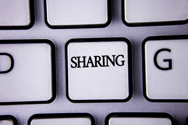 Text sign showing Sharing. Conceptual photo To Share Give a portion of something to another Possess in common written on White Keyboard Key with copy space. Top view. - Photo, Image