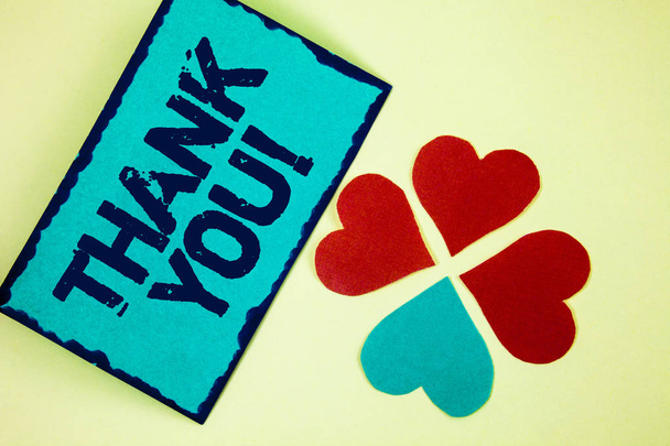 Word writing text Thank You Motivational Call. Business concept for Appreciation greeting Acknowledgment Gratitude written on Sticky Note paper on plain background Paper Love Hearts next to it. - Photo, Image