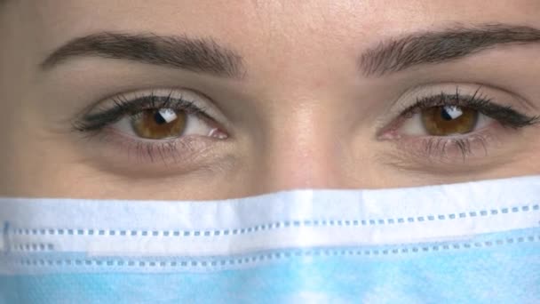 Macro view, female doctor eyes closing. - Video