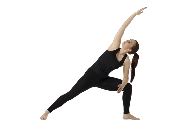 woman in twist position yoga - Foto, afbeelding