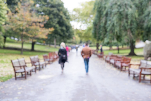 Blurred image bokeh of People walking in Princes Street Gardens, the public space in city center of Edinburgh. - Photo, Image