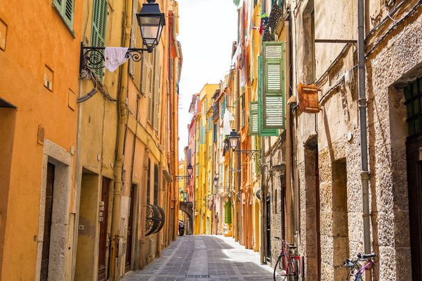 narrow street with colorful houses in Menton, cote d'azur, french riviera, France - Photo, Image