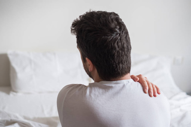 Uncomfortable mattress and pillow causes neck pain - Photo, image