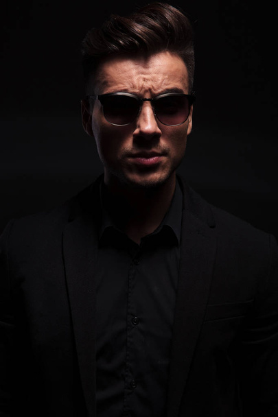portrait of handsome fashion man with black suit and sunglasses - Фото, зображення