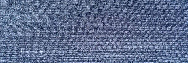Jeans denim stof broek textuur, blauwe achtergrond. - Foto, afbeelding
