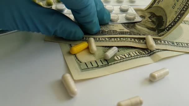 pills capsules falling dollars, hand, glove - Footage, Video