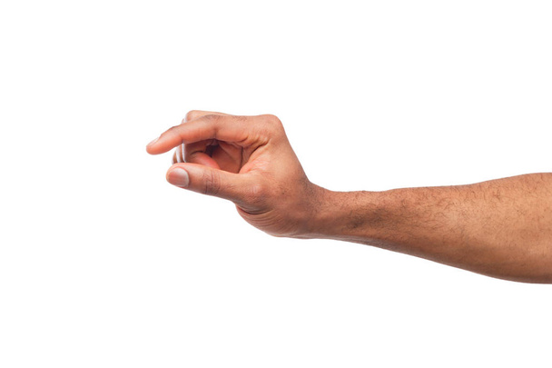 Αρσενική χέρι μέτρηση κάτι, cutout, χειρονομία - Φωτογραφία, εικόνα