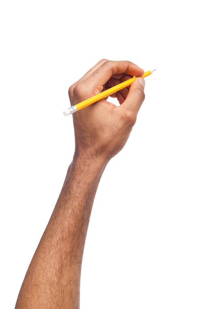 Negro mano masculina sosteniendo lápiz
 - Foto, Imagen