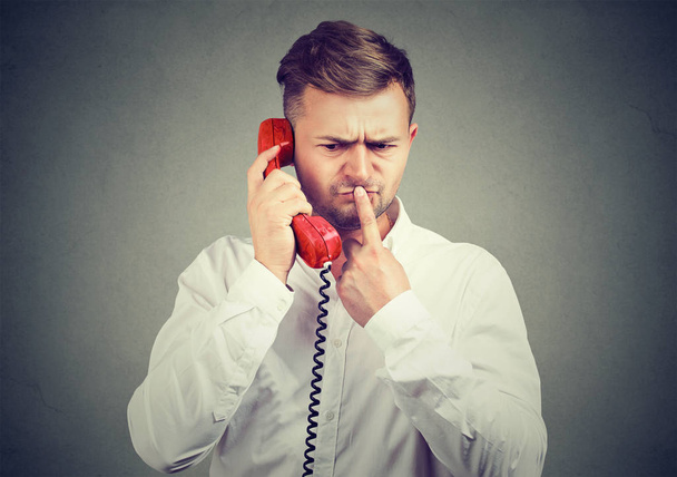Man having dilemma during phone call - Photo, image