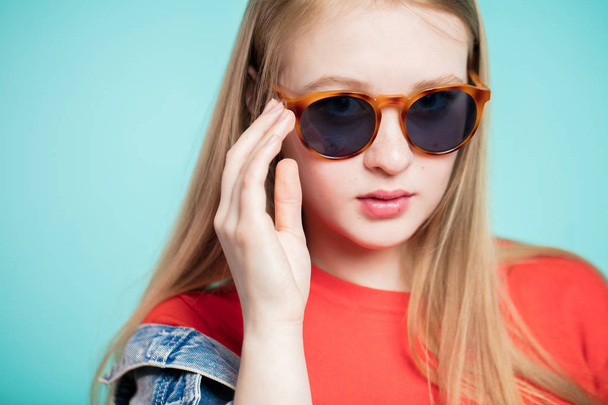 Close up shot of young woman in sunglasses - Fotó, kép