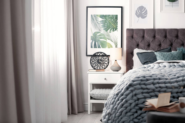 Modern room interior with comfortable bed - Фото, зображення