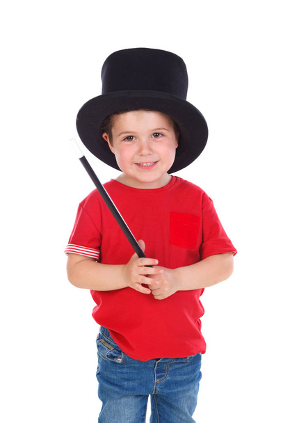 cute boy doing magic with top hat and magic wand isolated on white background - Foto, afbeelding