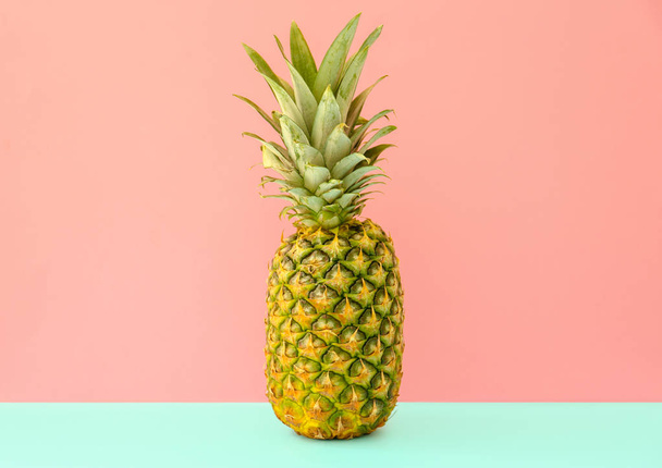 Fresh ripe pineapple on color background - Фото, изображение