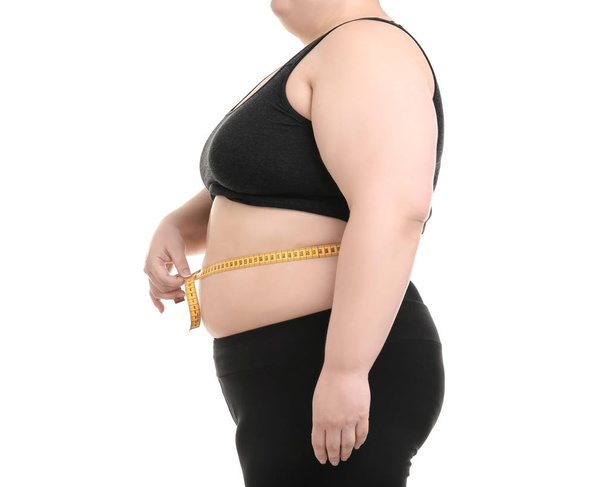 Overweight woman with measuring tape on white background - Zdjęcie, obraz