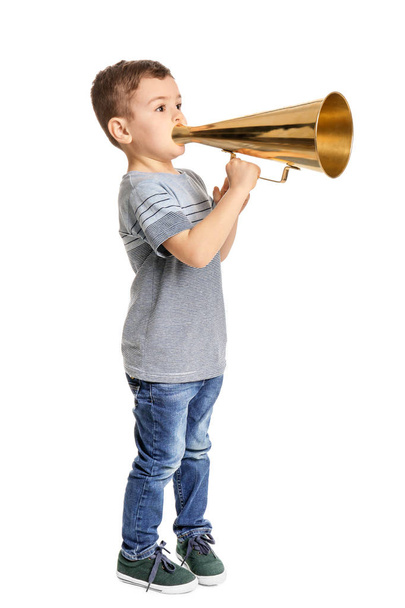 Adorable little boy with vintage megaphone on white background - 写真・画像