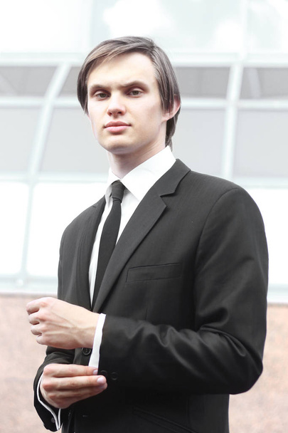 portrait of a young businessman on blurred background - Photo, Image