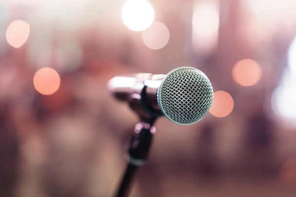 Close up microphone on stage in concert hall restaurant or conference room. Blurred background. Copy space - Photo, Image