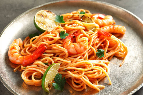 Delicious pasta with shrimps on plate - Fotoğraf, Görsel