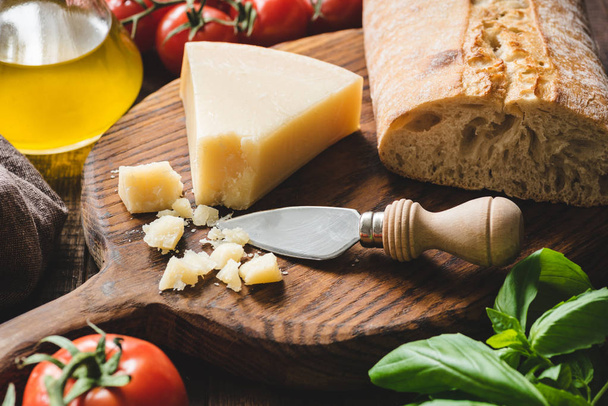 Parmesan cheese on a wooden board - Zdjęcie, obraz