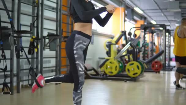 Concept of a healthy lifestyle. Training young woman in the gym - Footage, Video