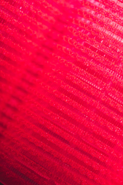 macro-opname van rode haartextuur krultang - Foto, afbeelding