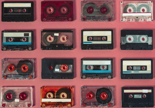Vintage Audio Tapes In Row  On Lilac Background, Top View. Retro - Zdjęcie, obraz