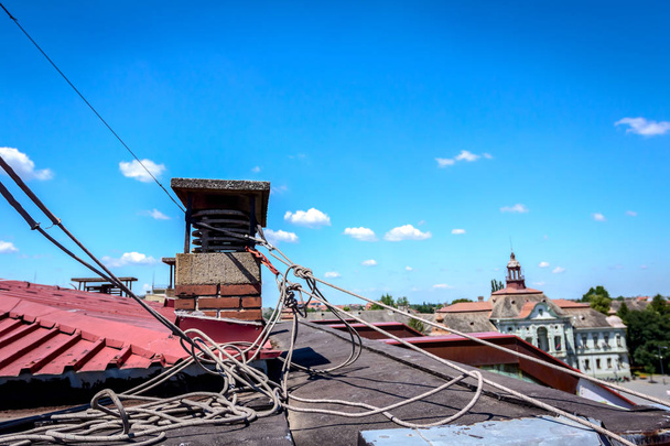 Industrial climbers are bounded their ropes to the chimney  - Photo, Image
