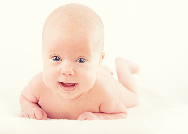 Happy naked newborn baby on white background - Photo, Image