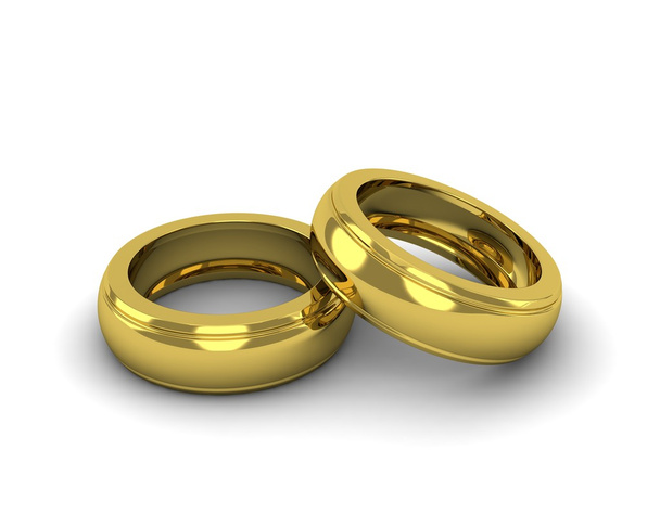 κομψό χρυσά γαμήλια δαχτυλίδια που απομονώνονται σε λευκό φόντο - Φωτογραφία, εικόνα