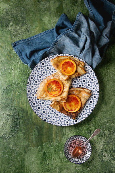 Pancakes with bloody oranges - Фото, изображение