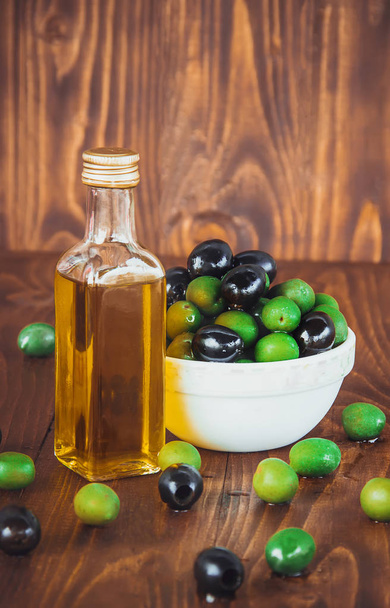 olives and olive oil. Selective focus.   - Zdjęcie, obraz