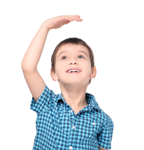 Little boy measuring height on white background - Photo, Image