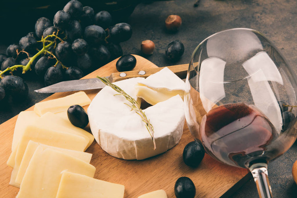 Cheese platter with a grapes. - 写真・画像