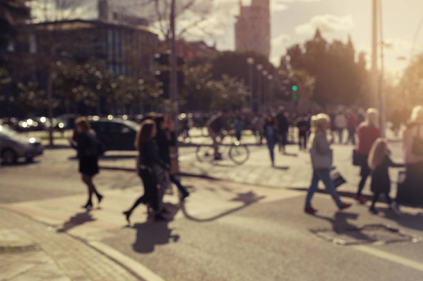 Blurred image of people moving in crowded city street. - Photo, Image