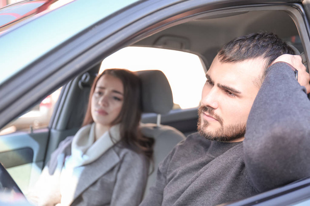 Young couple in car during traffic jam - Foto, Bild
