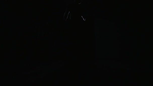 Silhouette of a dancing man who dances ballroom dancing - Felvétel, videó