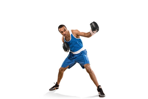 Sporty man during boxing exercise. Photo of boxer on white background - Foto, imagen