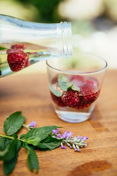 Pouring Infused Water In The Glass - Photo, Image