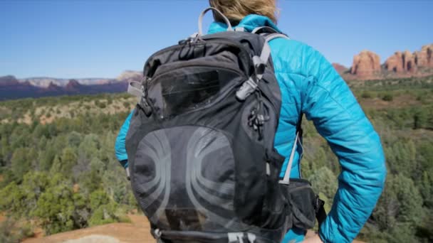 Healthy Caucasian European female hiker with rucksack hiking outdoors in  Verde Valley Arizona America  - Footage, Video
