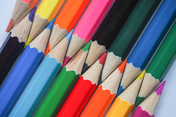 Colored pencils. Abstract colored background. Colored pencils in hand. - Photo, Image
