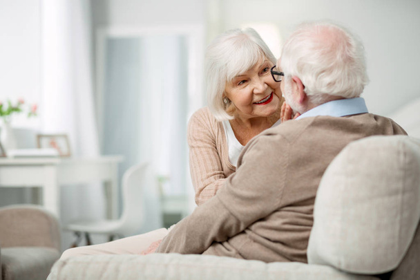 Pleasant elderly woman having a conversation with her husband - Фото, зображення