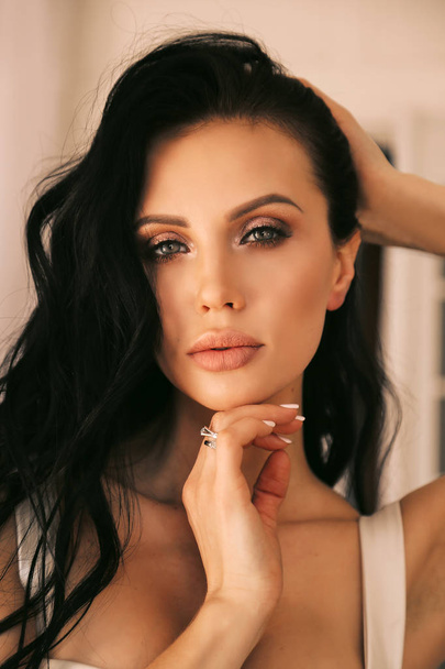 sexy beautiful woman with dark hair and evening makeup, in elega - Photo, Image