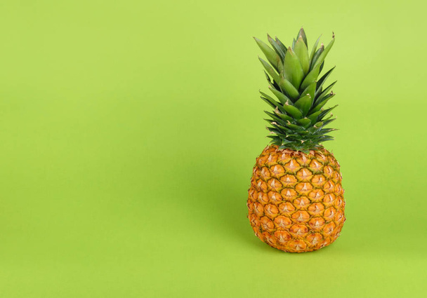 Pineapple on green background - Фото, зображення