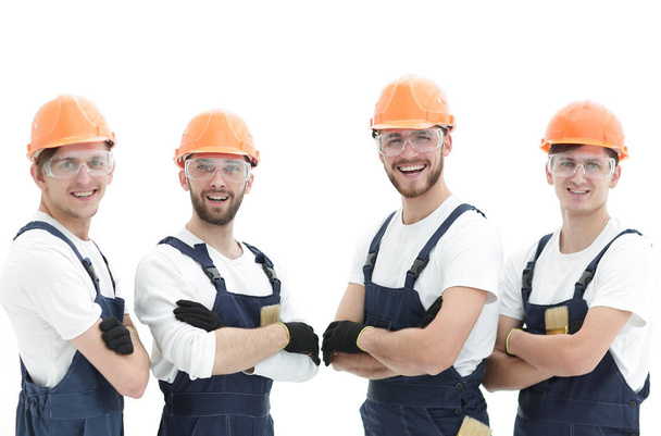smiling team of construction workers . - Foto, imagen