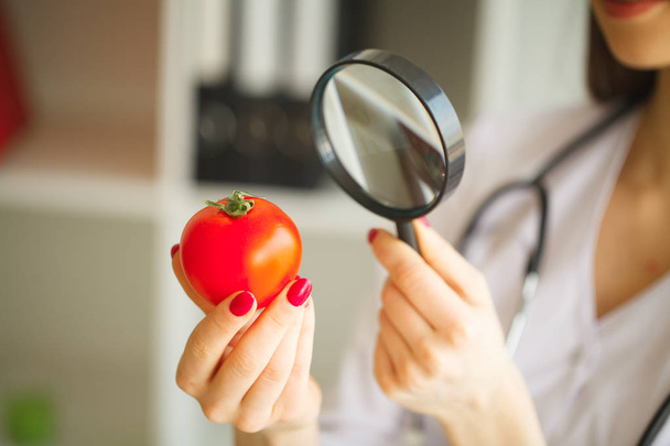 Dietitian Inspecting Vegetables with Magnifying Glass - Fotó, kép