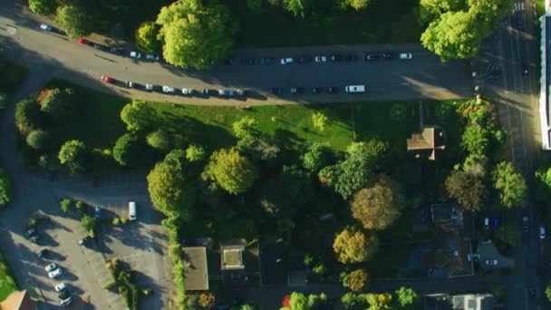 Aerial view sunrise over London suburban residential houses, roads and community outdoor sports facilities England United Kingdom  - Footage, Video