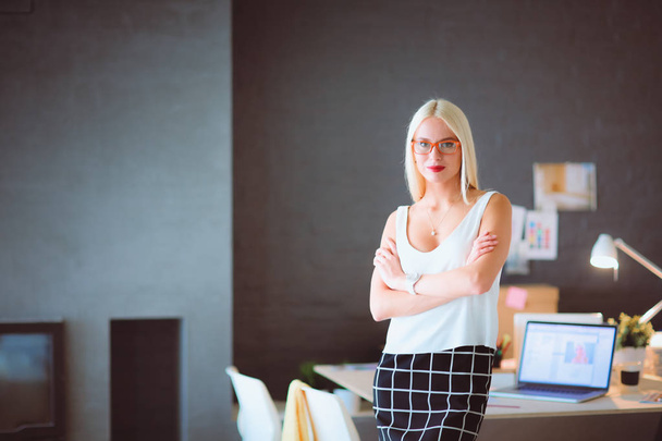 Portrait of an executive professional mature businesswoman sitting on office - Foto, afbeelding